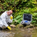 Scientist examing toxic water